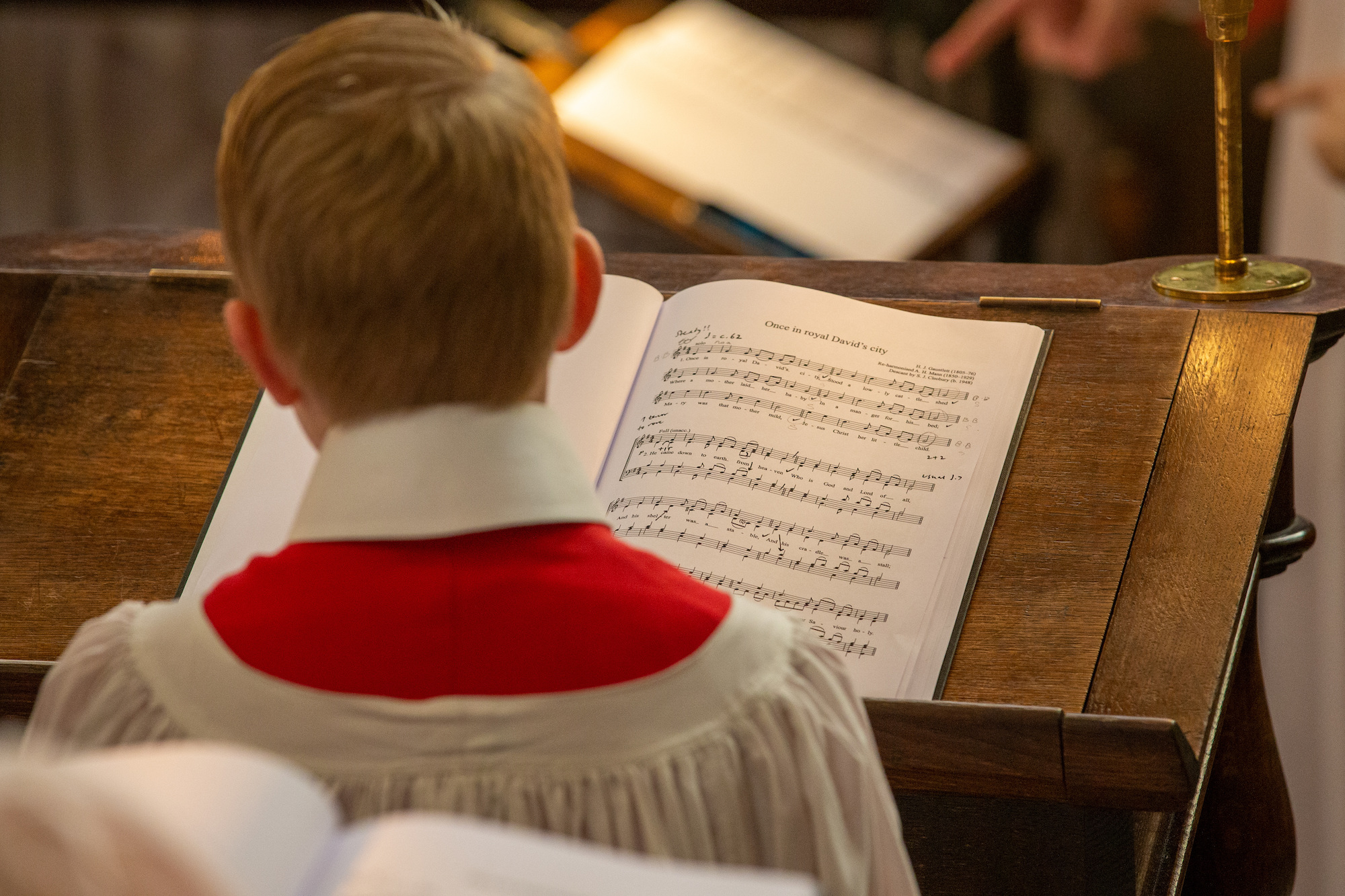 A chorister in front of his music