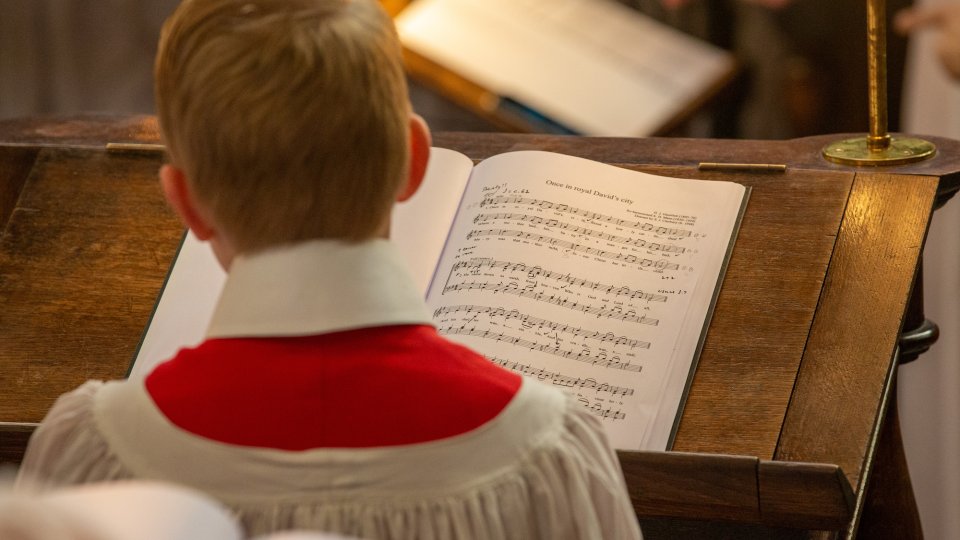 A chorister in front of his music