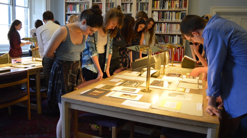 Students viewing an exhibition of Rupert Brooke papers.