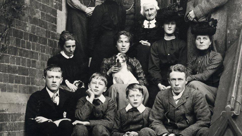 Group photograph of the Brooke and Cotterill families on steps outside house.  Rupert in the centre of the front row (RCB/Ph/9)