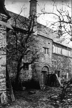 Lantern slide of C.R. Ashbee outside the Norman Chapel, Broad Campden. [CRA/21/7]